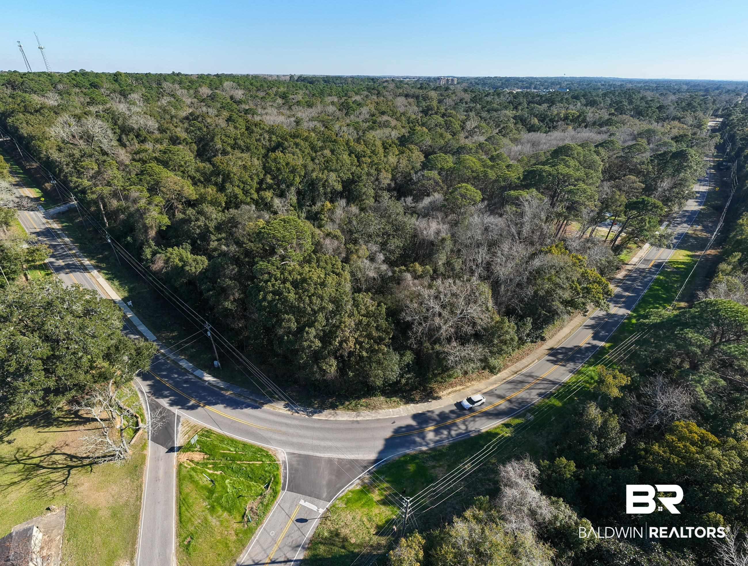 Image 4: View of property location with a heavily wooded area