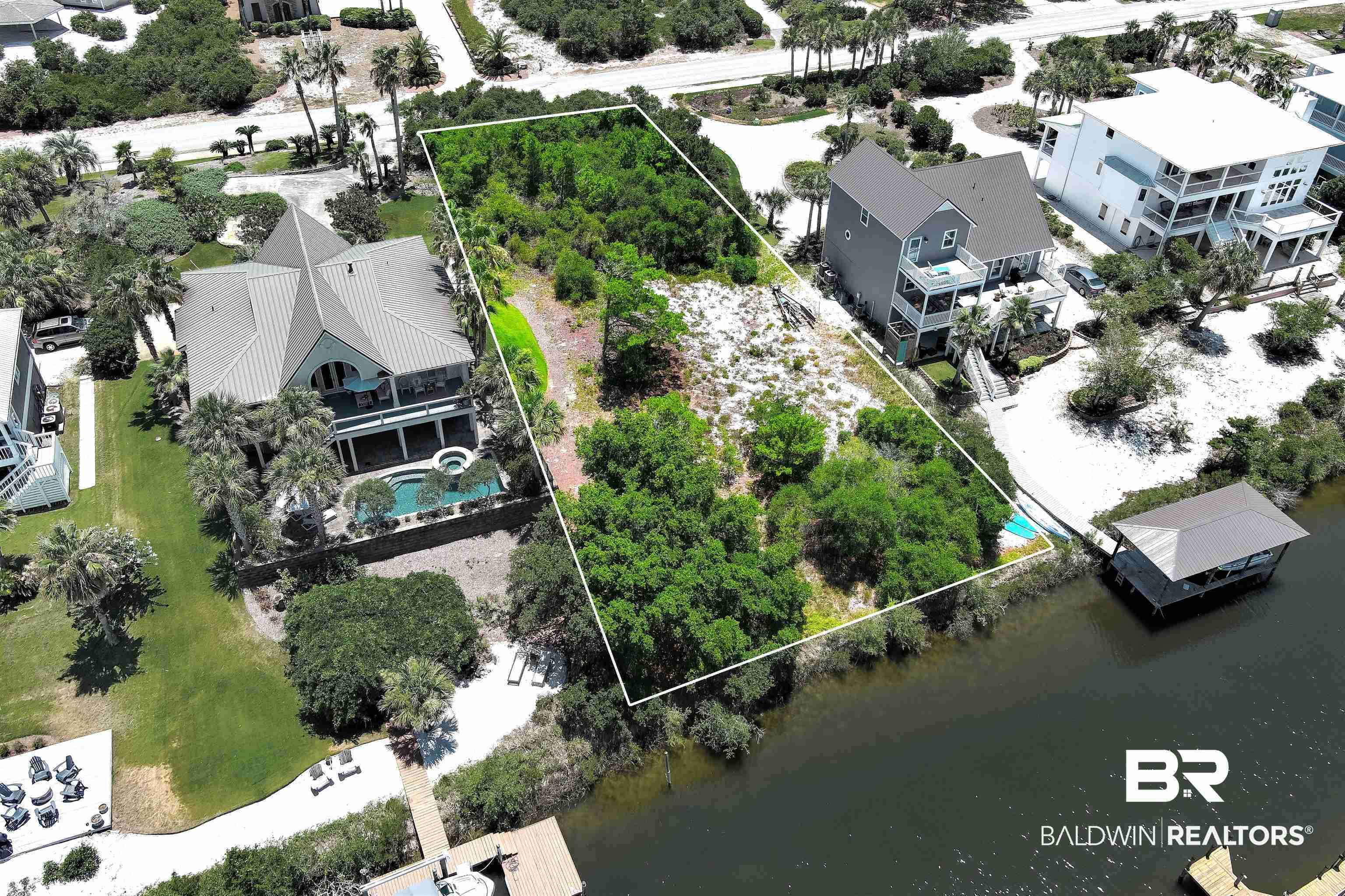 Image 1: Aerial view featuring a water view