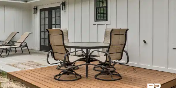 Image 3: Wooden terrace featuring outdoor dining space