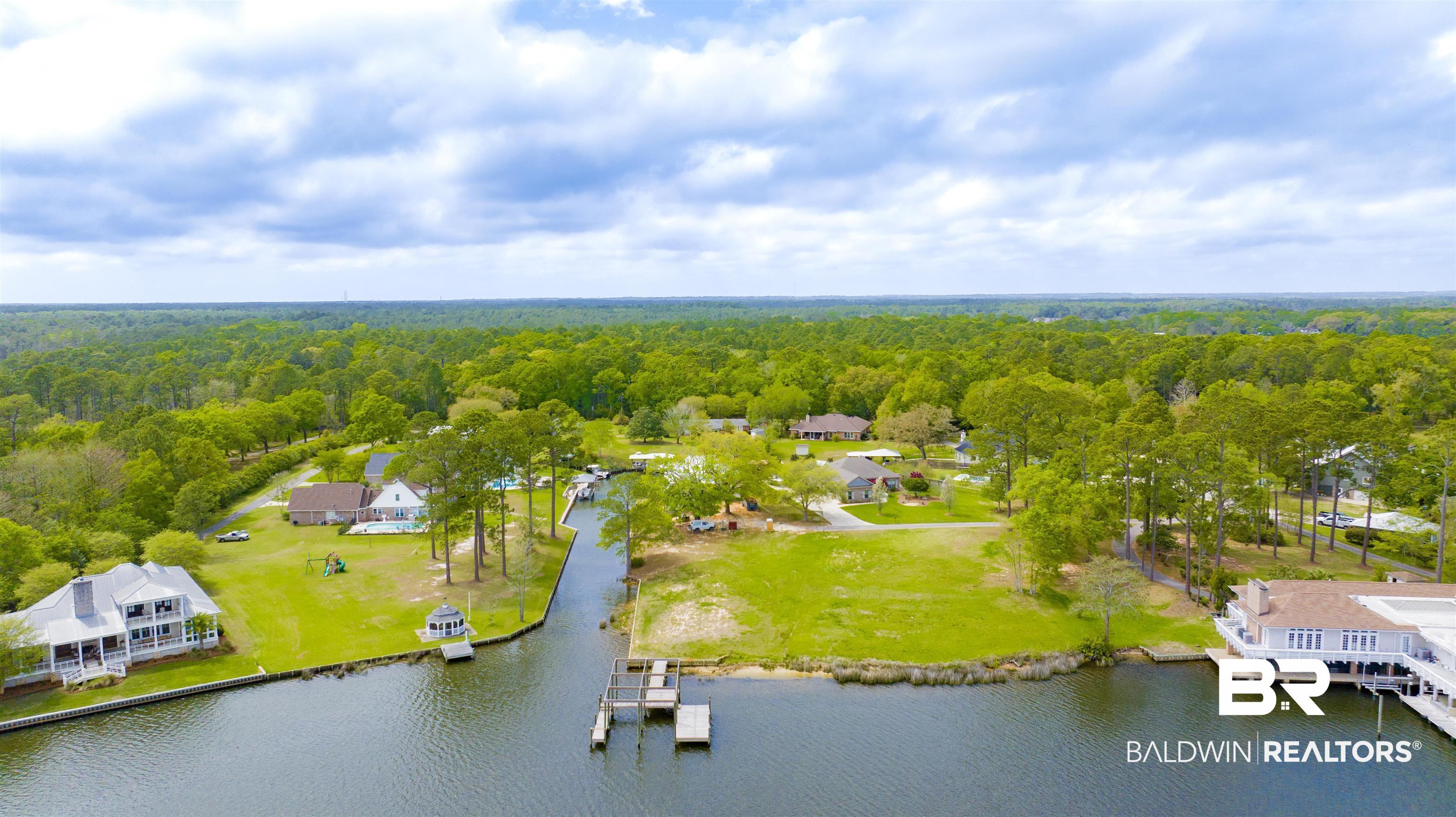 Image 3: Bird's eye view of a heavily wooded area and a large body of water
