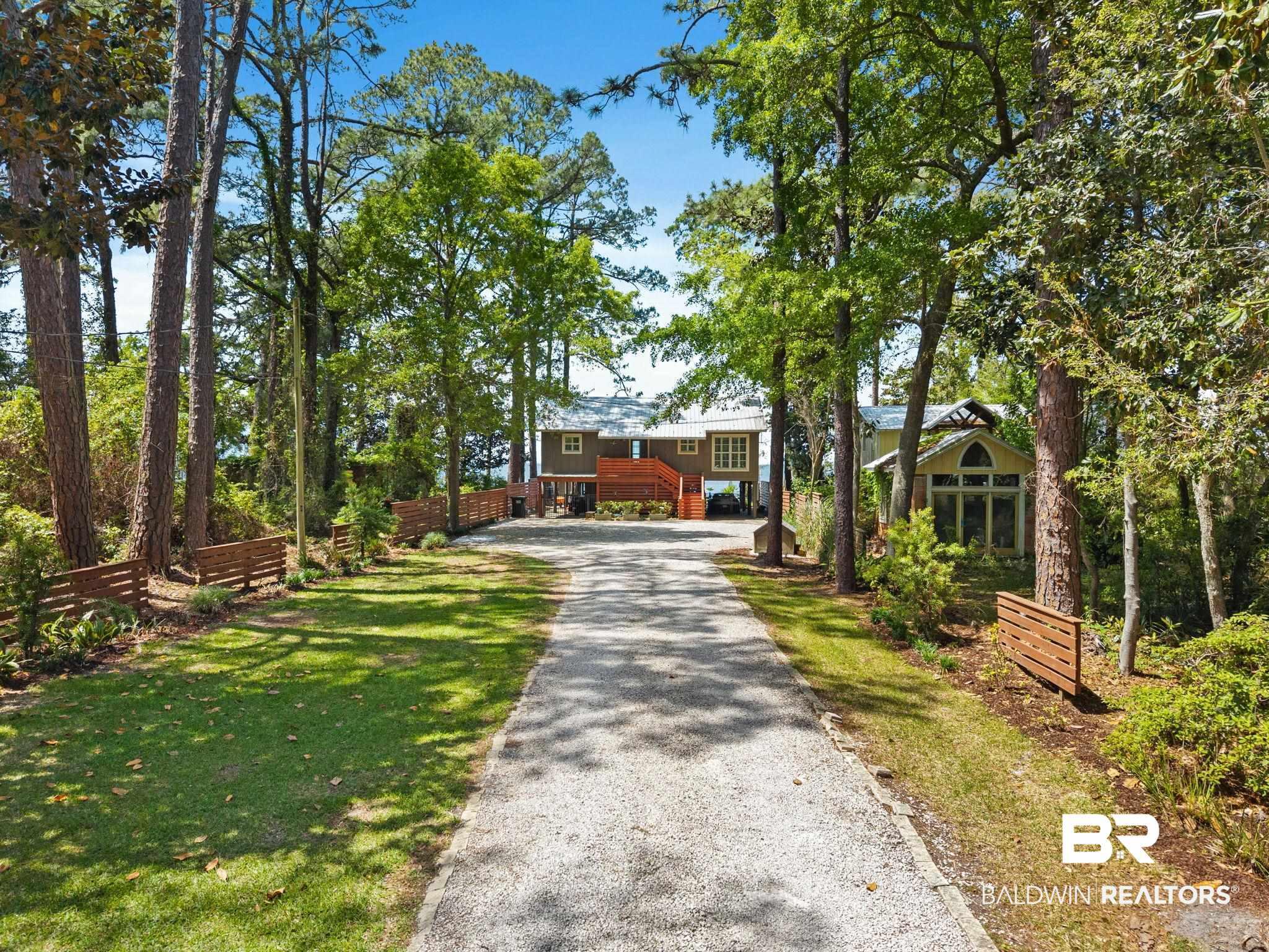 Image 2: View of front of property with driveway