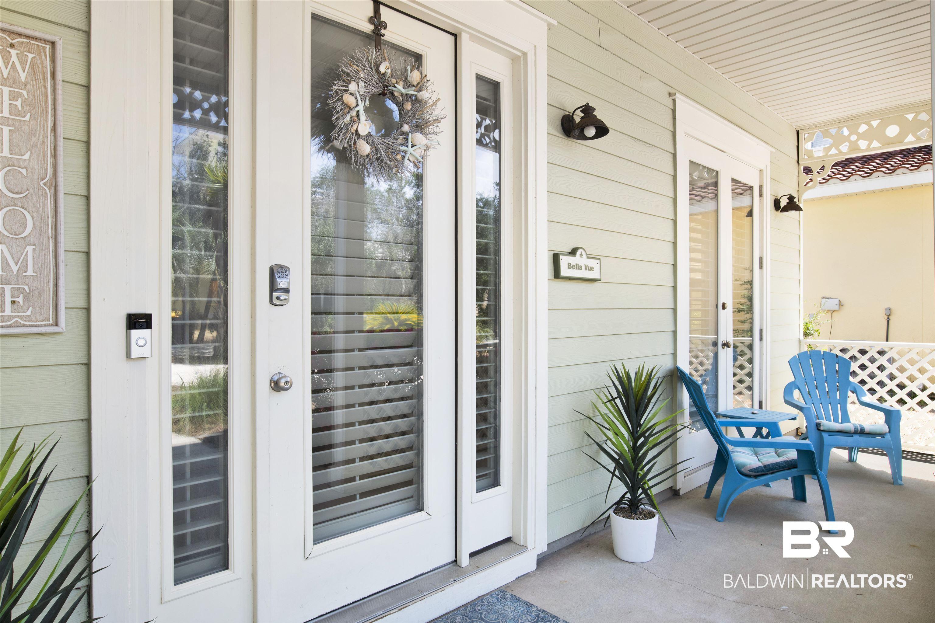 Image 2: Property entrance with covered porch