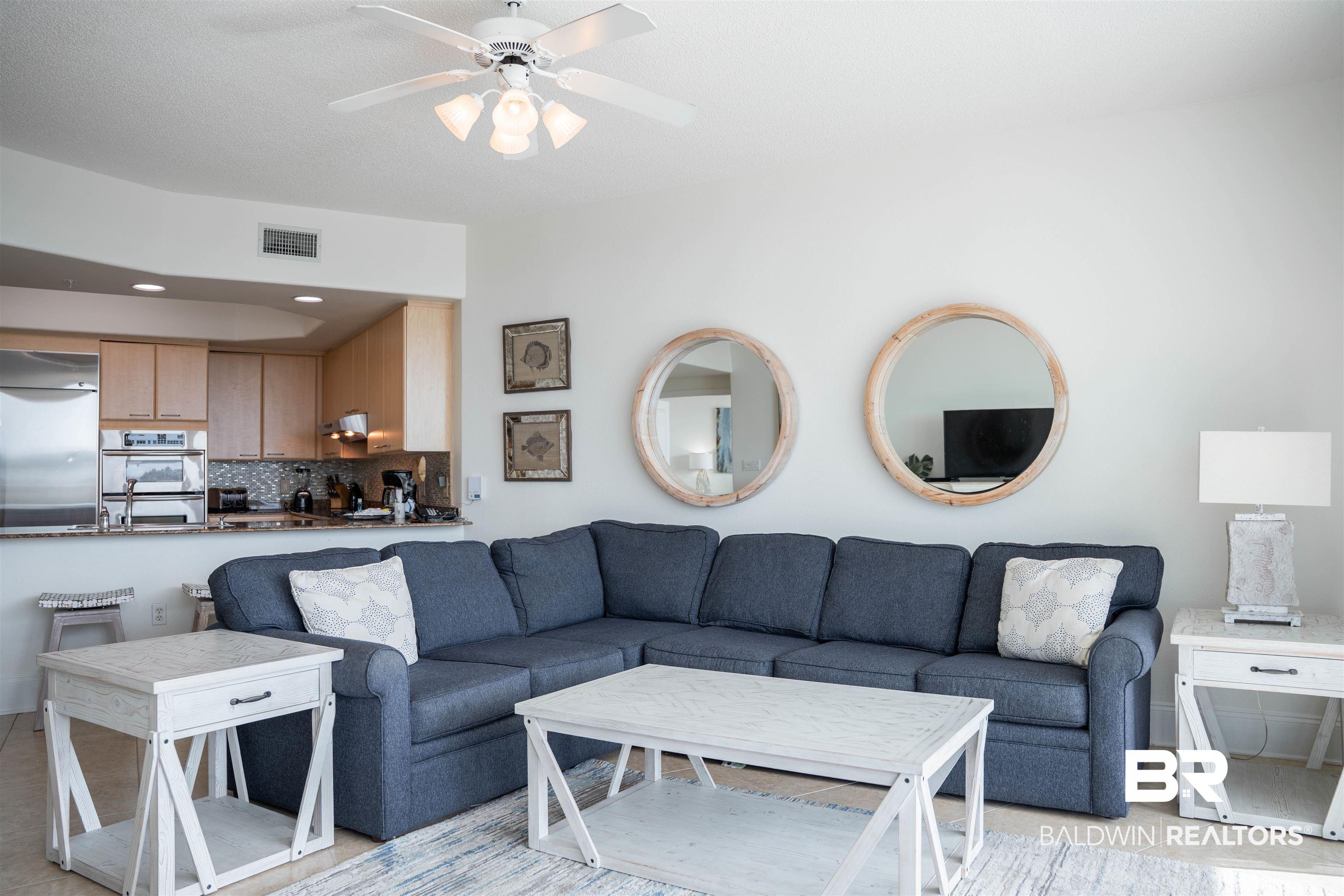 Image 4: Living room featuring light tile patterned floors, recessed lighting, and ceiling fan