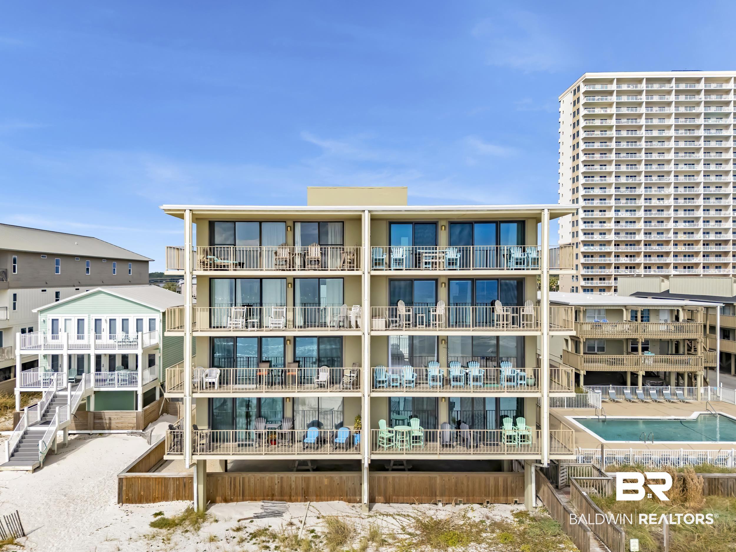 Image 1: View of apartment building / complex