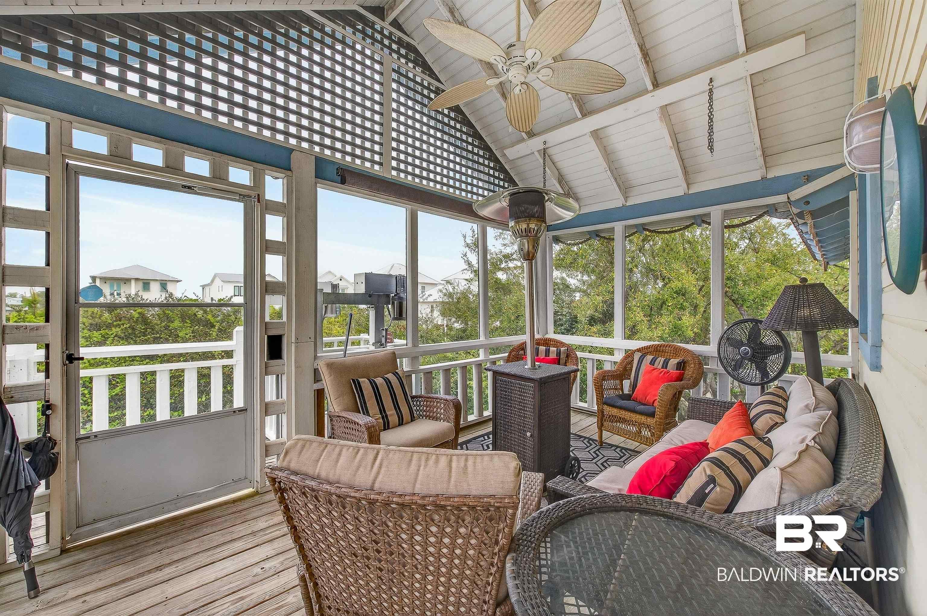 Image 2: Sunroom featuring ceiling fan, an outdoor hangout area, a wooden deck, and beamed ceiling