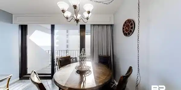 Image 4: Dining space featuring a notable chandelier