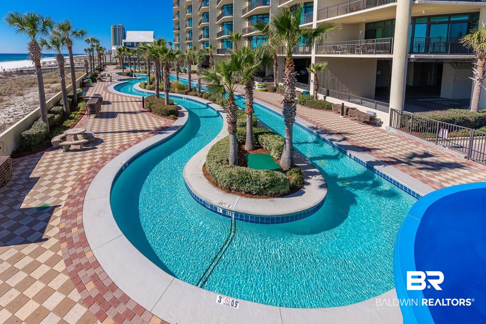 Image 4: Community pool featuring a patio area