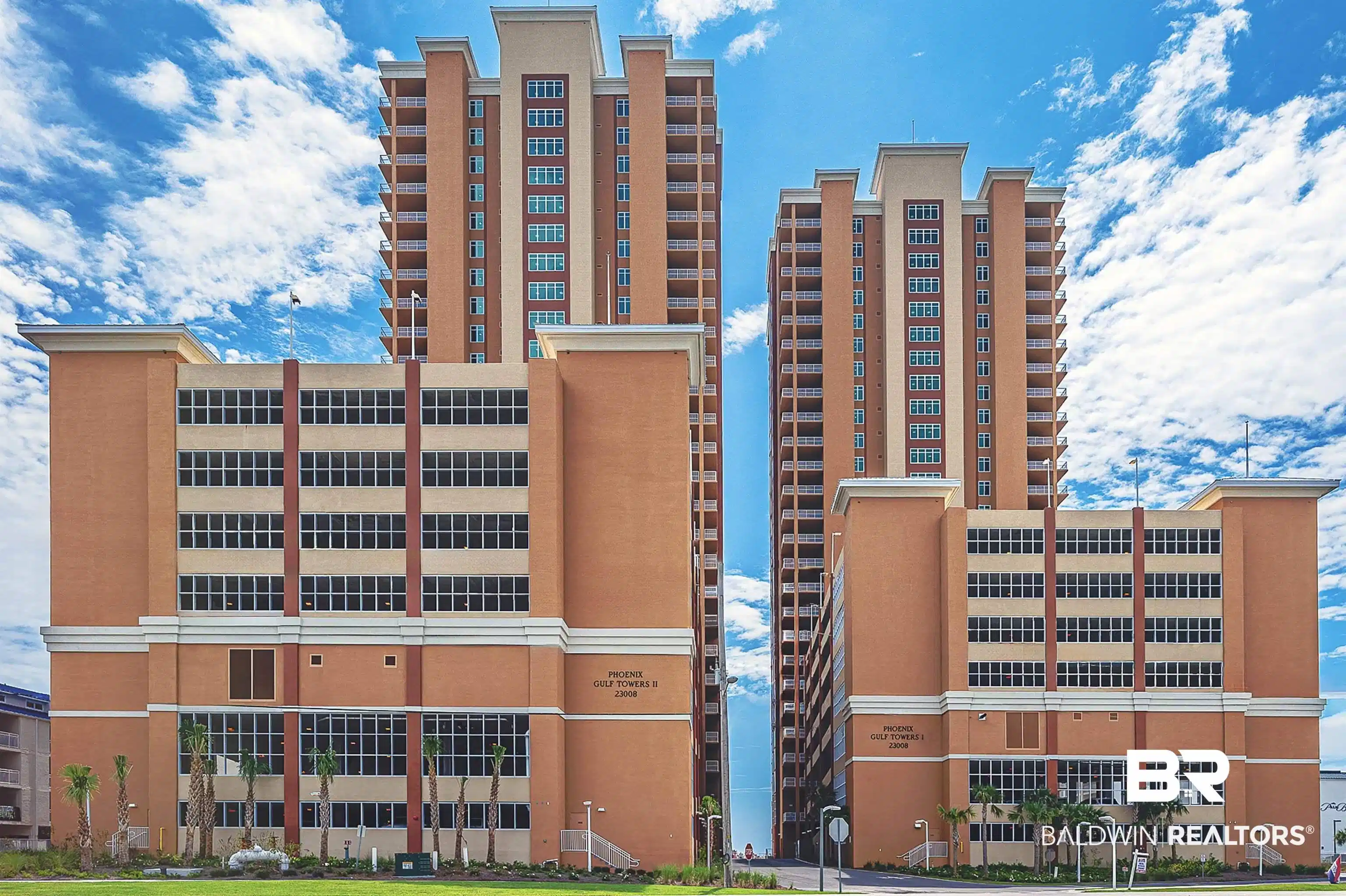 Image 1: Twin high-rise towers featuring numerous balconies and a multi-level parking structure