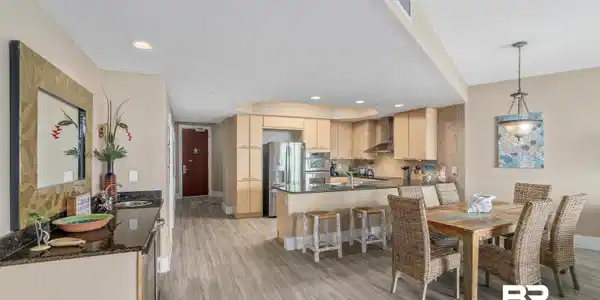 Image 3: Dining area with light hardwood / wood-style floors and sink