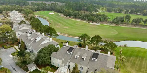 Image 4: Drone / aerial view of a nearby body of water and a golf course