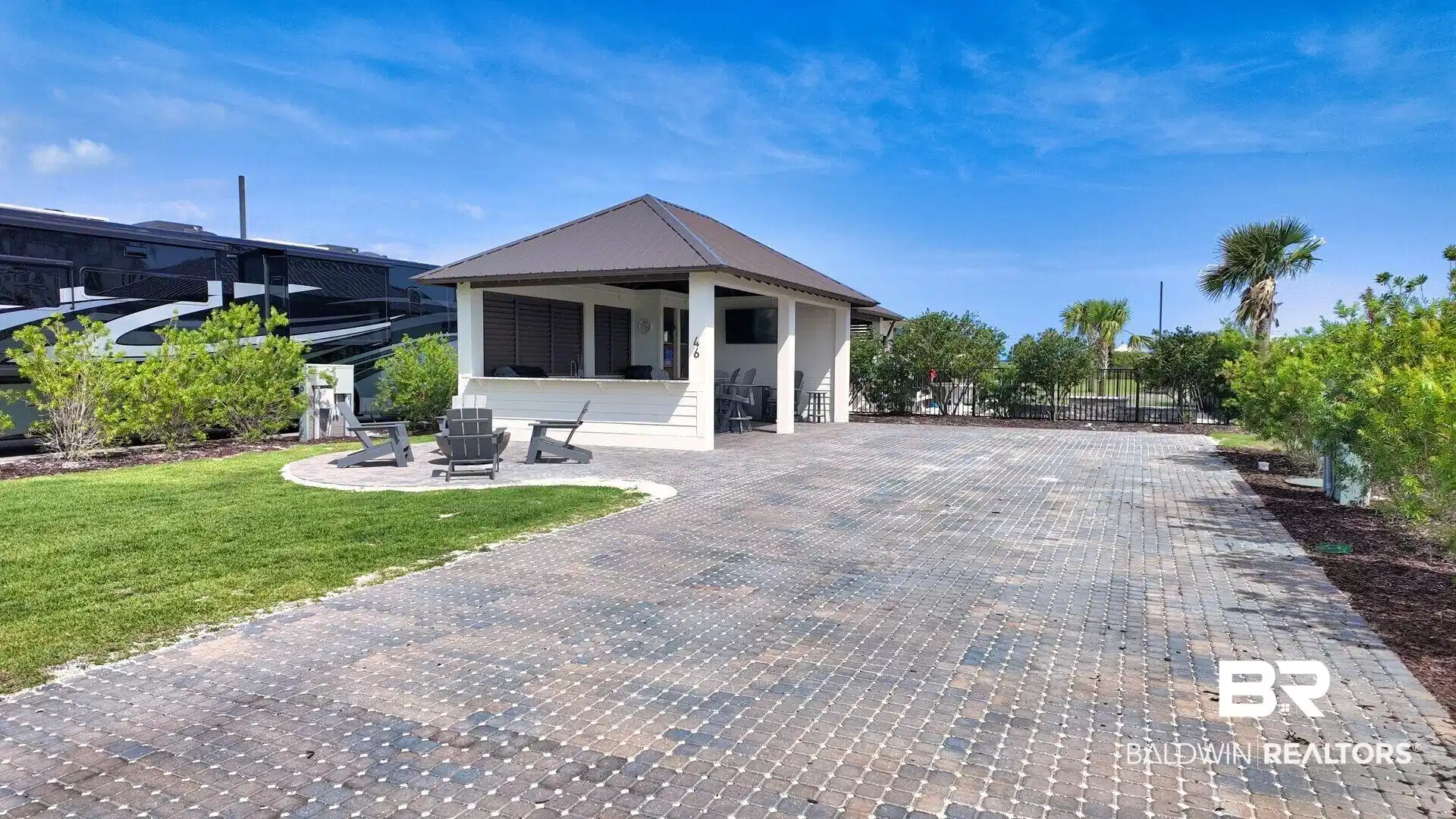 Image 1: Exterior space with a metal roof