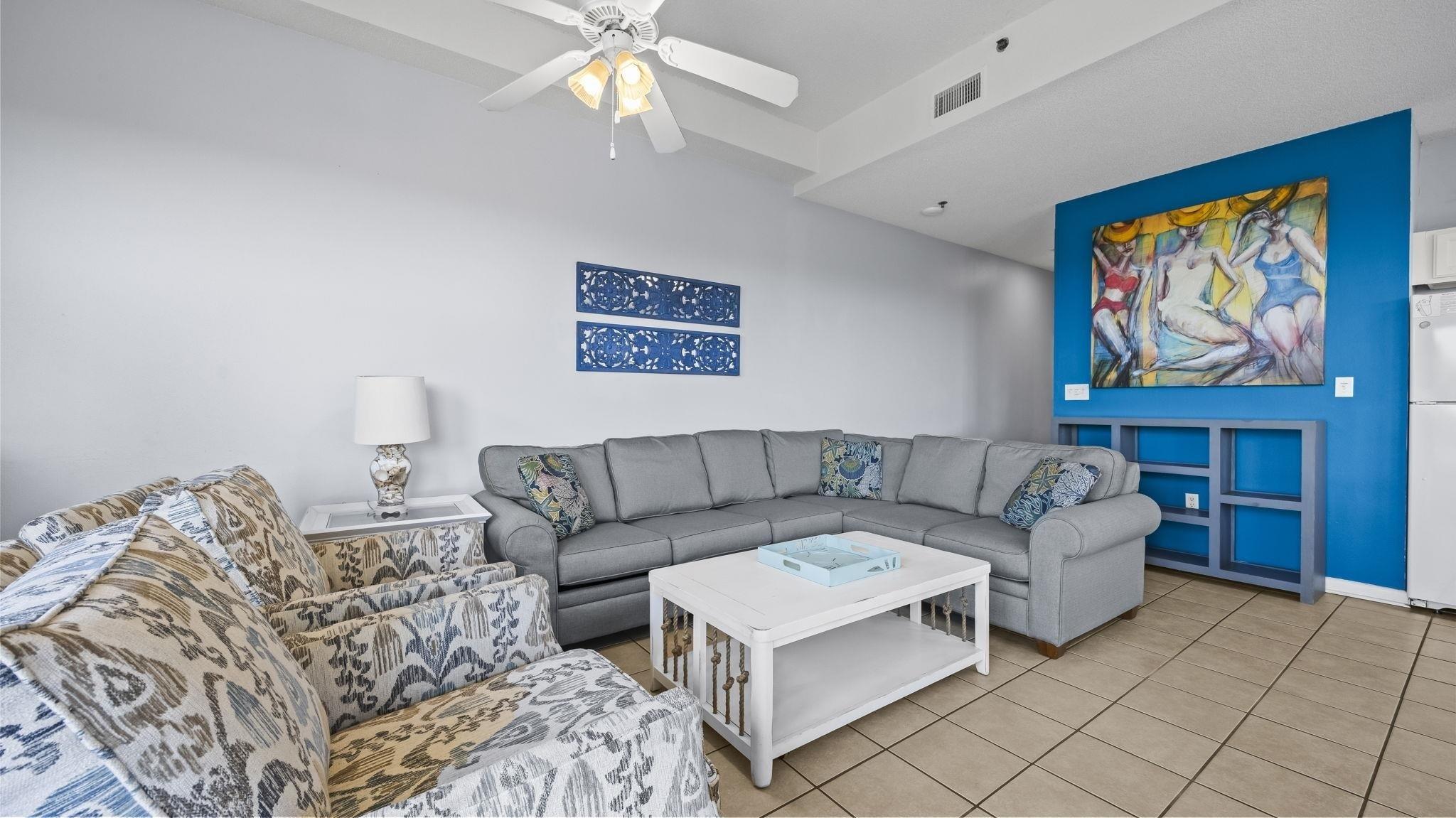 Image 3: Tiled living room featuring ceiling fan