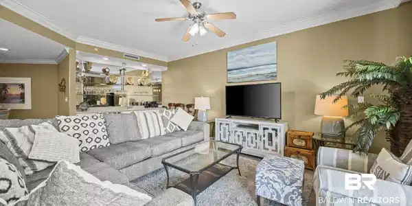 Image 3: Living area featuring ornamental molding and a ceiling fan