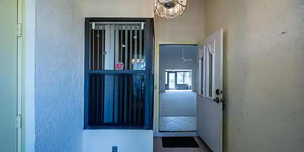Image 2: Entryway, front door, and garage door
