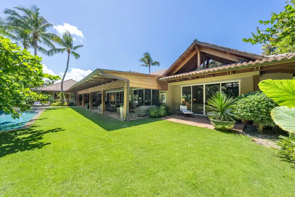 Image 1: Pool and gardens surrounding home on a .78 acre lo