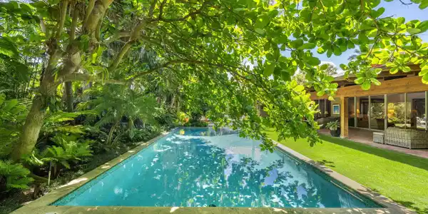 Image 4: Pool surrounded by magical gardens and home sited