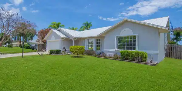 Image 2: Front of House, new lawn. AI generated