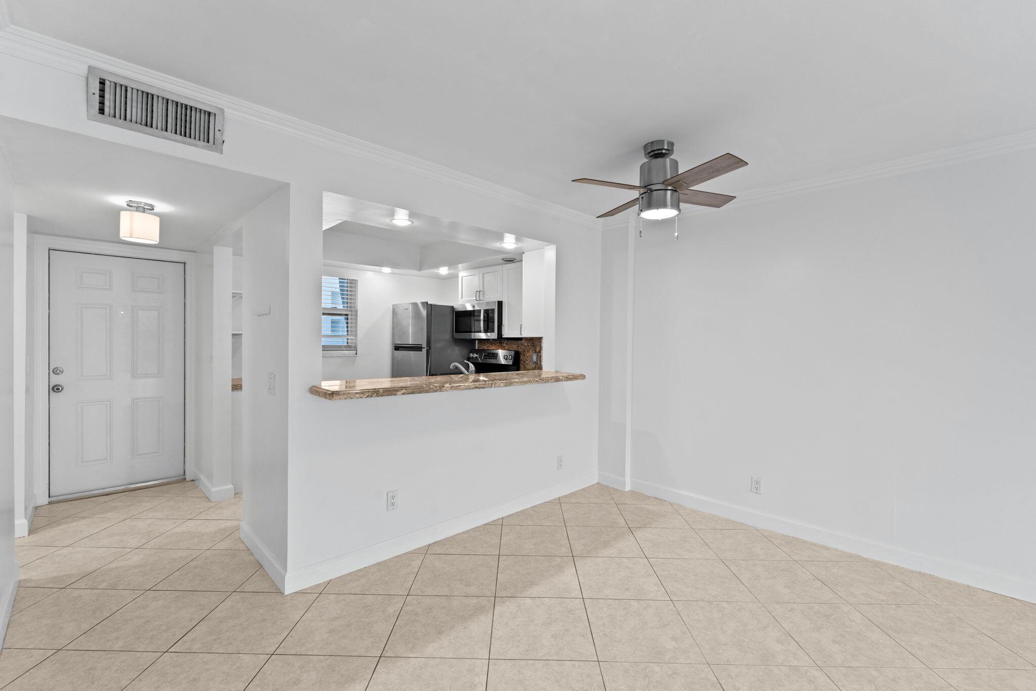Image 4: Tiled flooring extending throughout, ceiling fan w