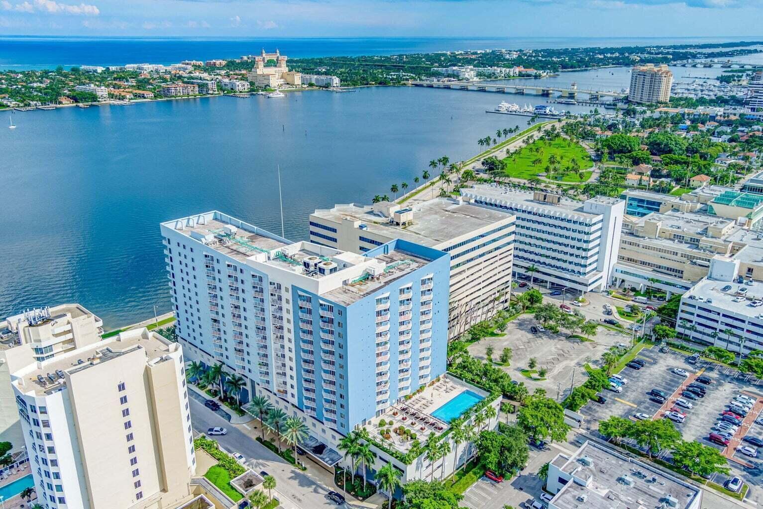 Image 2: Waterfront high-rise building featuring a rooftop