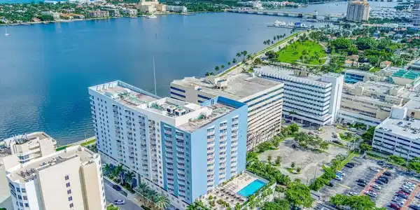 Image 2: Waterfront high-rise building featuring a rooftop