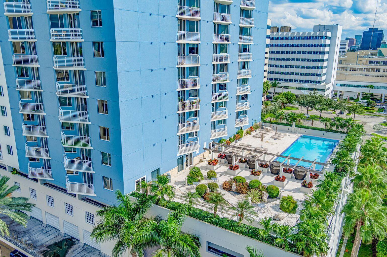 Image 3: Rooftop amenity deck featuring a swimming pool, lo