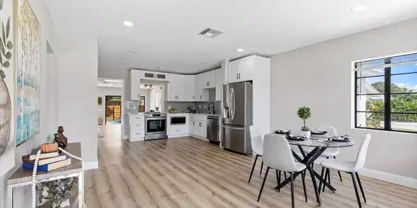 Image 4: Open-concept living space with wood-finish floorin