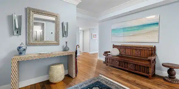 Image 4: Wood-finish flooring, crown molding, a console tab