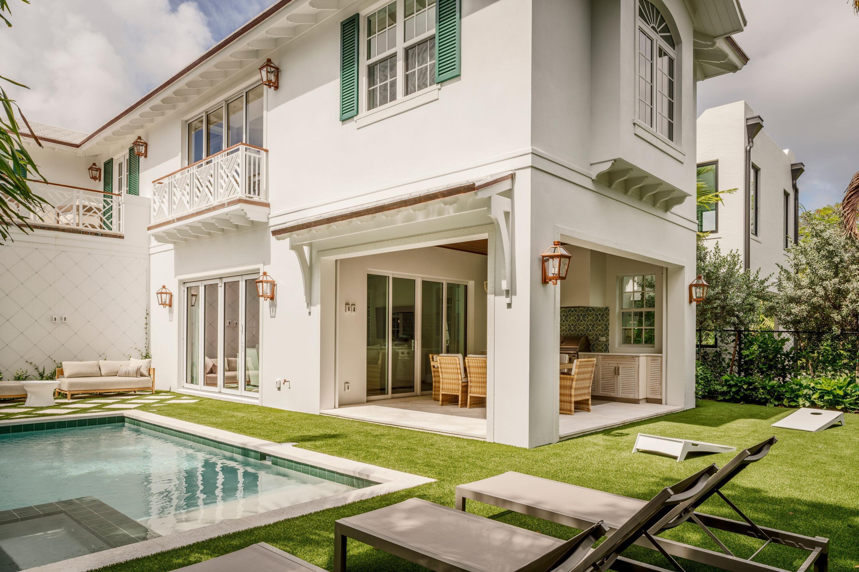 Image 2: 04 - White home exterior with covered pa