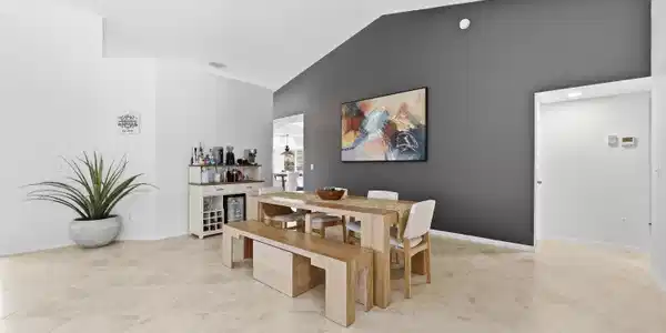 Image 4: Vaulted ceilings in an open-concept room featuring