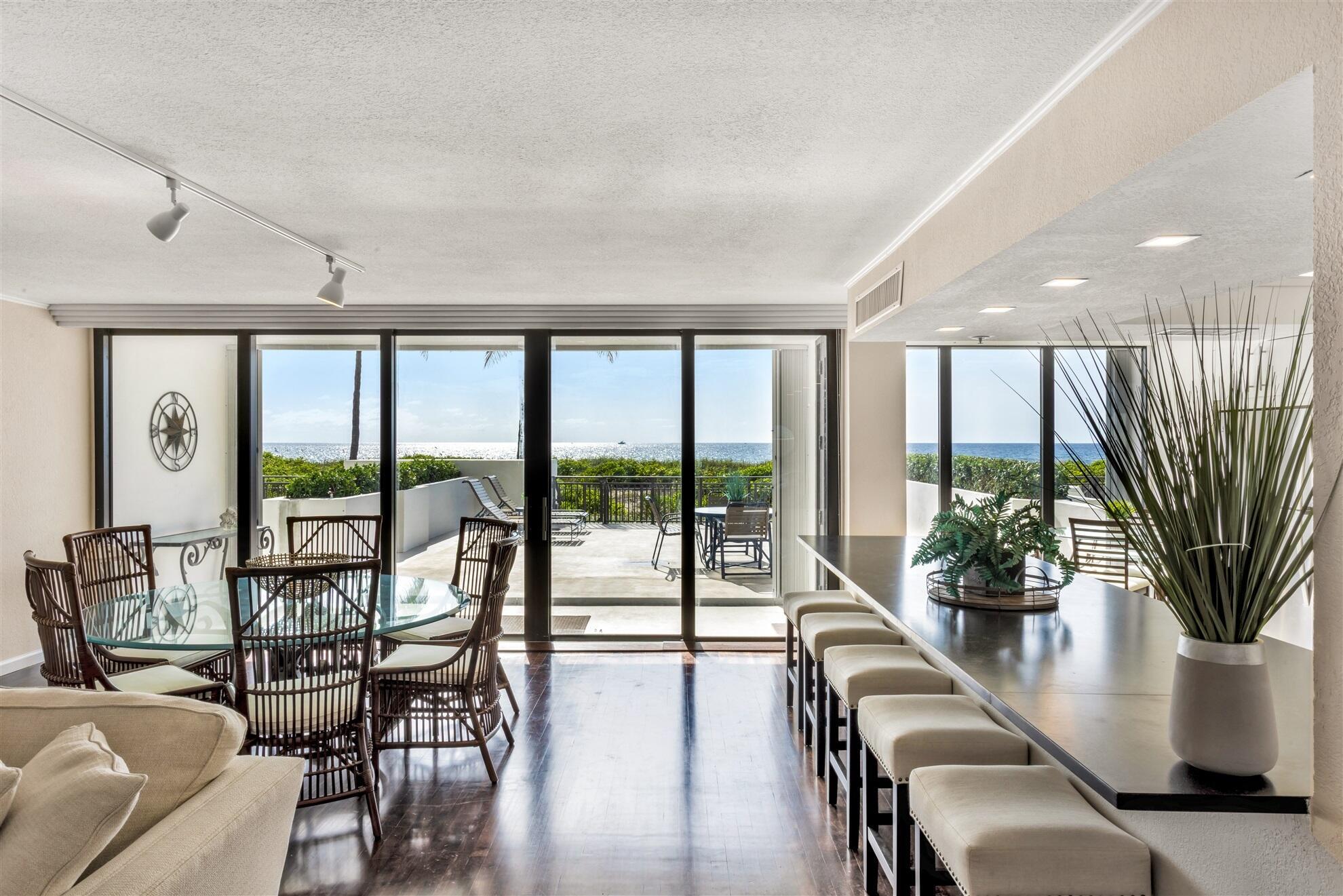 Image 2: LIVING ROOM TO PATIO & OCEAN VIEW