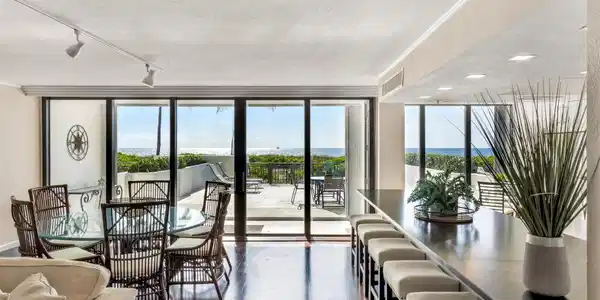 Image 2: LIVING ROOM TO PATIO & OCEAN VIEW