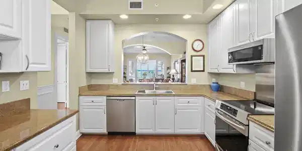 Image 3: Another view of kitchen that opens to dining/livin