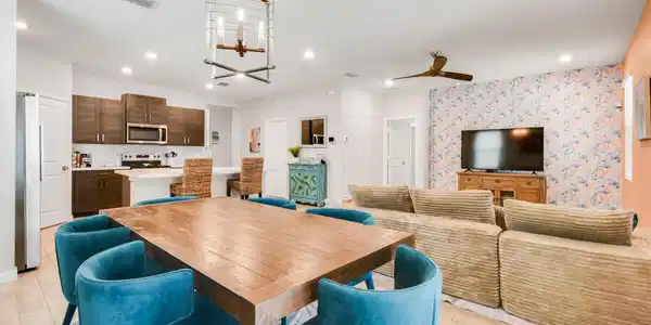 Image 4: Open-concept living area featuring wood-plank tile