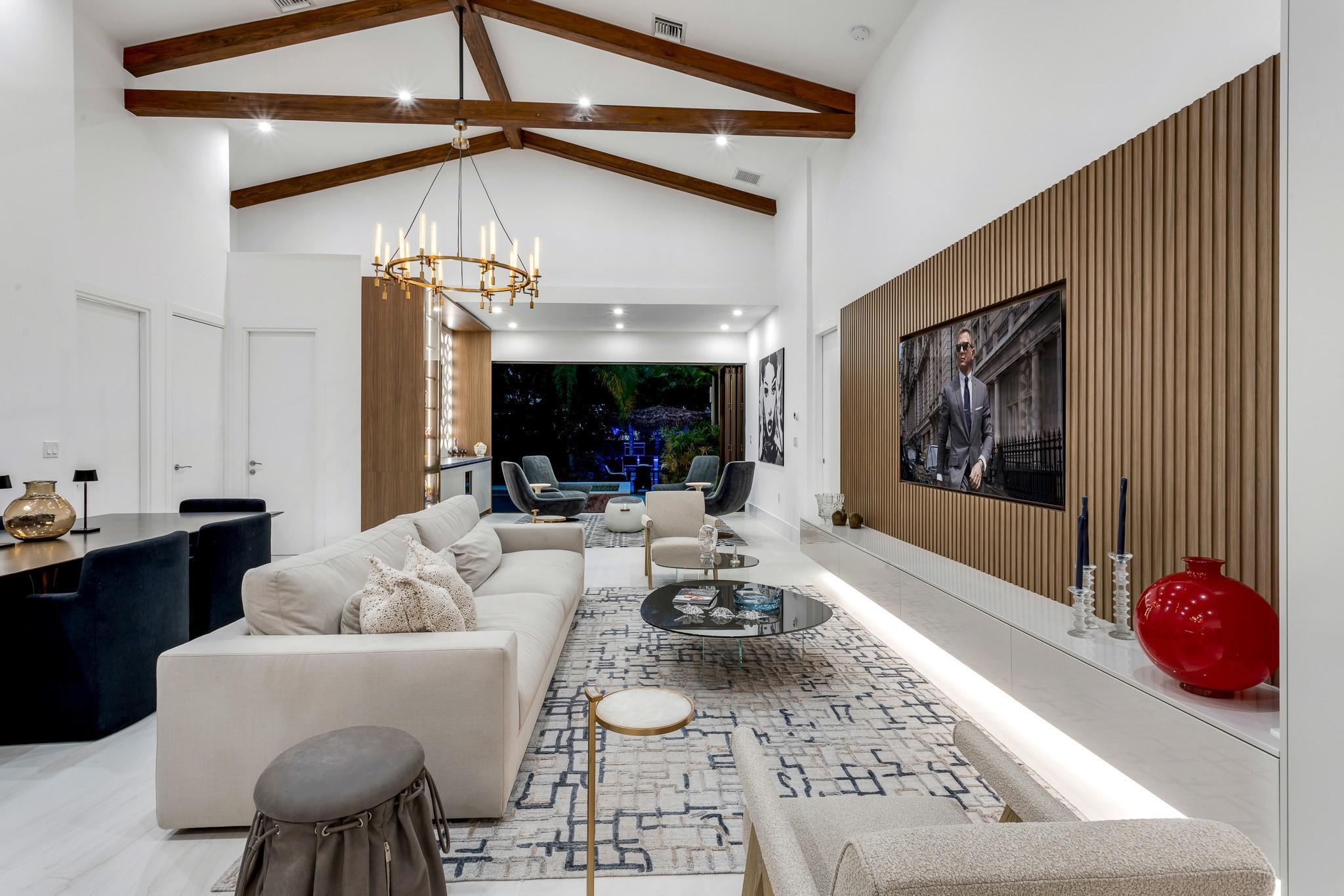 Image 1: Statement great room with custom media wall and en