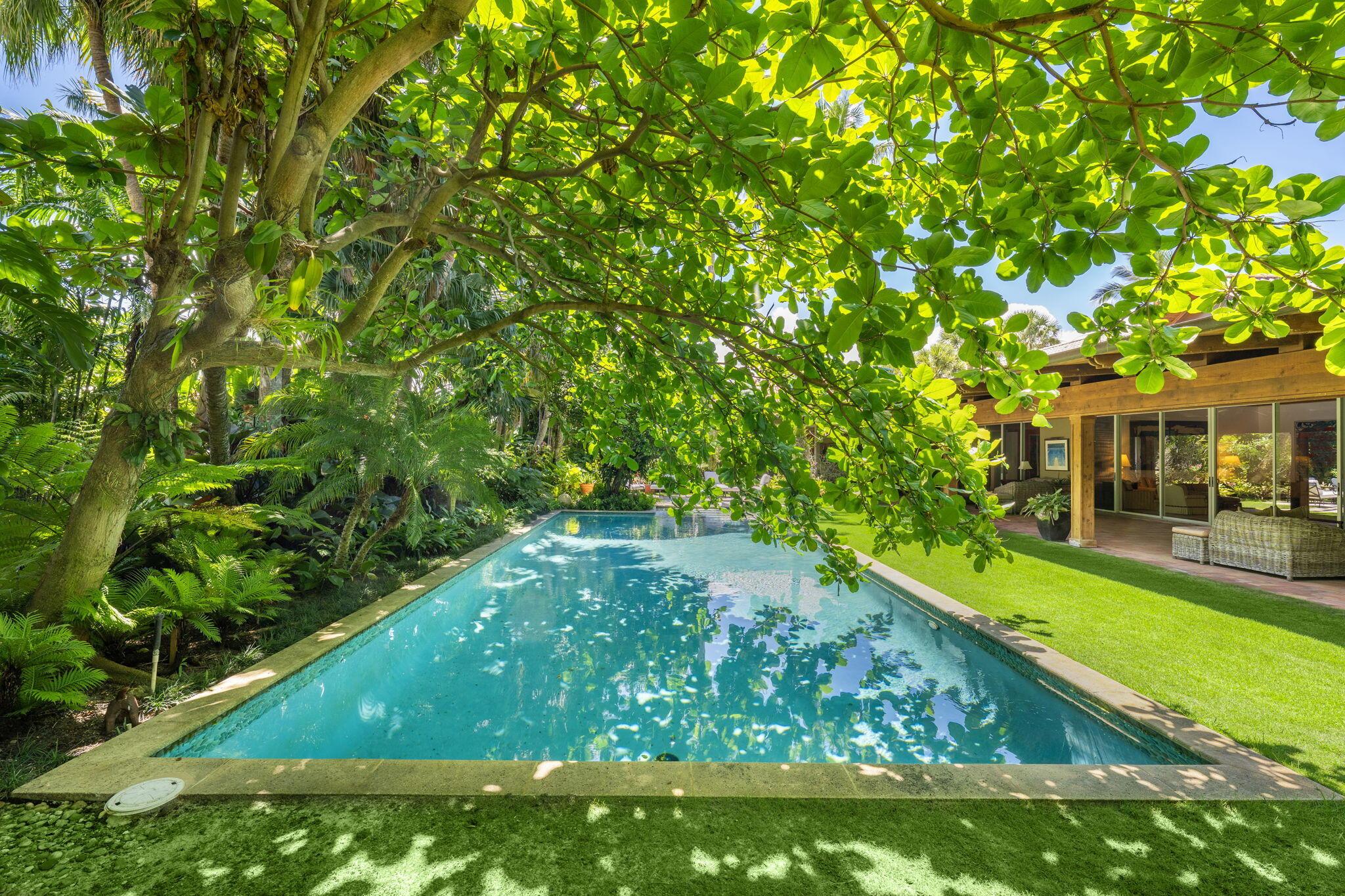 Image 4: Pool surrounded by magical gardens and home sited