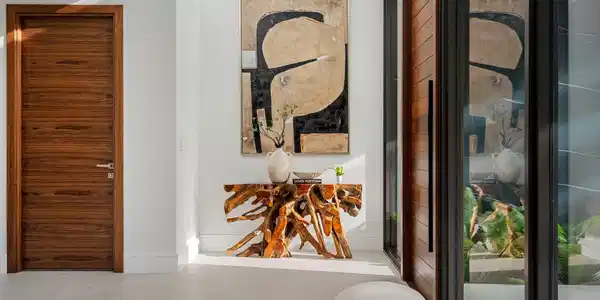Image 2: A refined entry vignette showcasing a rich wood fr