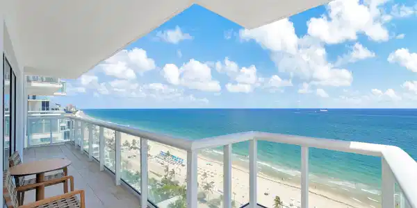 Image 2: approx. 320 SF wraparound balcony showcasing sweep
