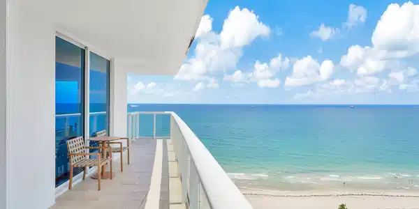 Image 3: approx. 320 SF wraparound balcony showcasing sweep
