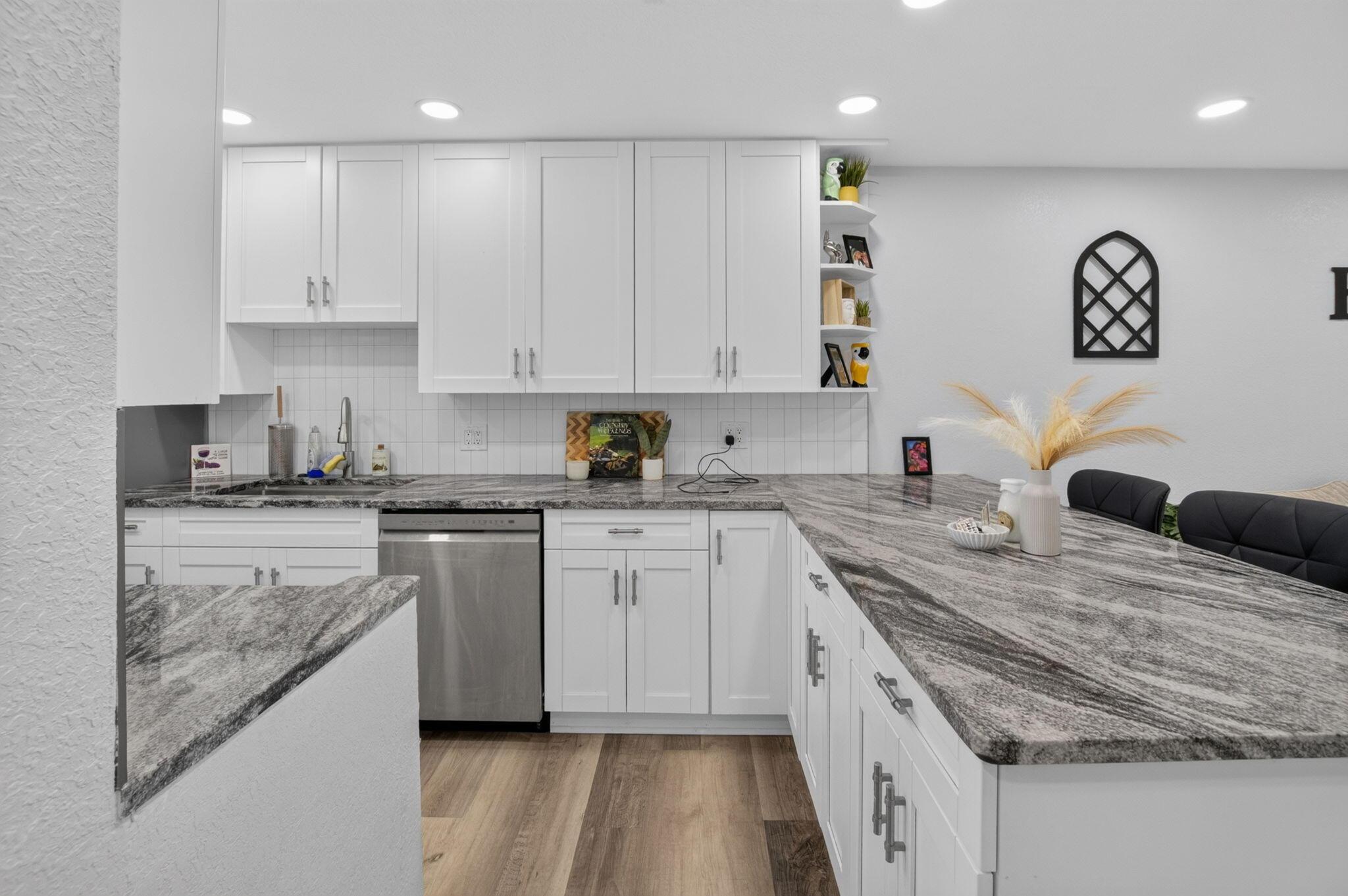 Image 4: Modern kitchen featuring white shaker cabinetry, s