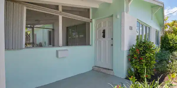 Image 3: Front door entryway and screened patio o