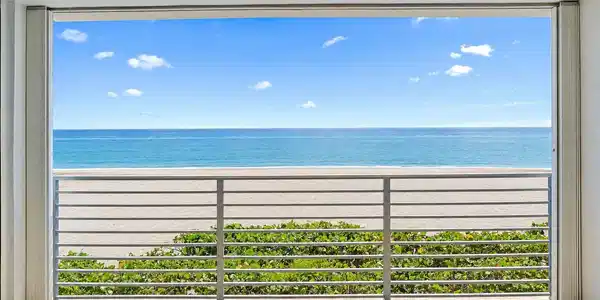 Image 3: Enjoy beach views from your spacious patio.