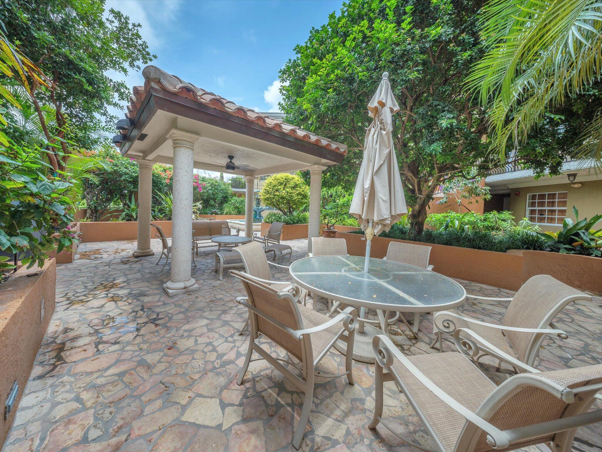 Image 3: Relax outdoors in a serene gazebo patio area