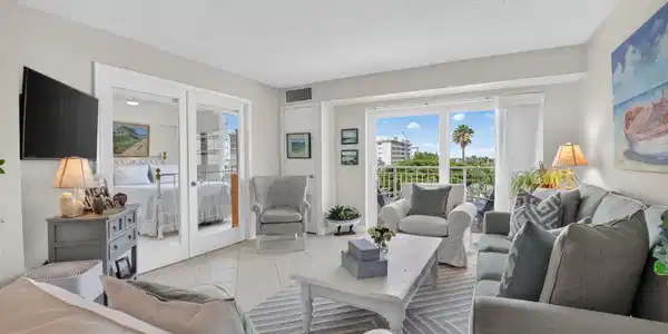 Image 4: LIVING ROOM WITH BALCONY ACCESS
