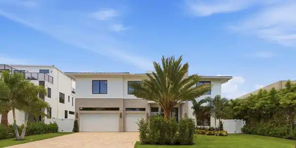 Image 3: Contemporary two-story residence featuring a paver