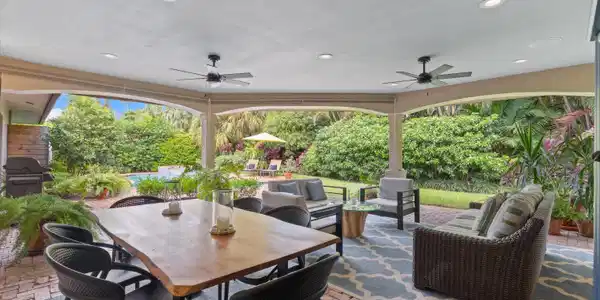 Image 4: Expansive covered patio with recessed lighting and