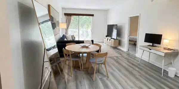 Image 3: Light wood-finish flooring throughout the open-con