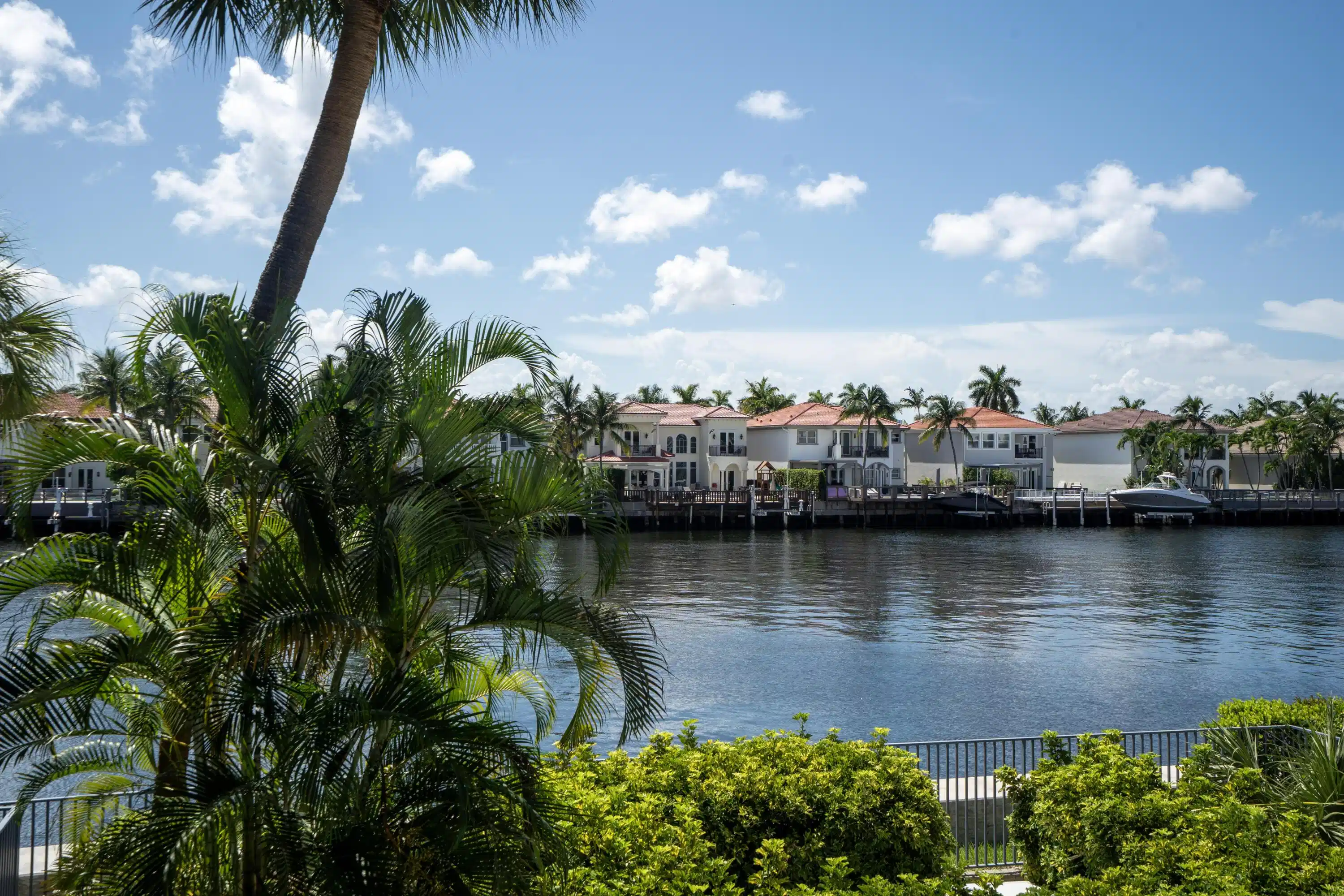 Image 1: Waterfront scenery featuring a blue sky with scatt