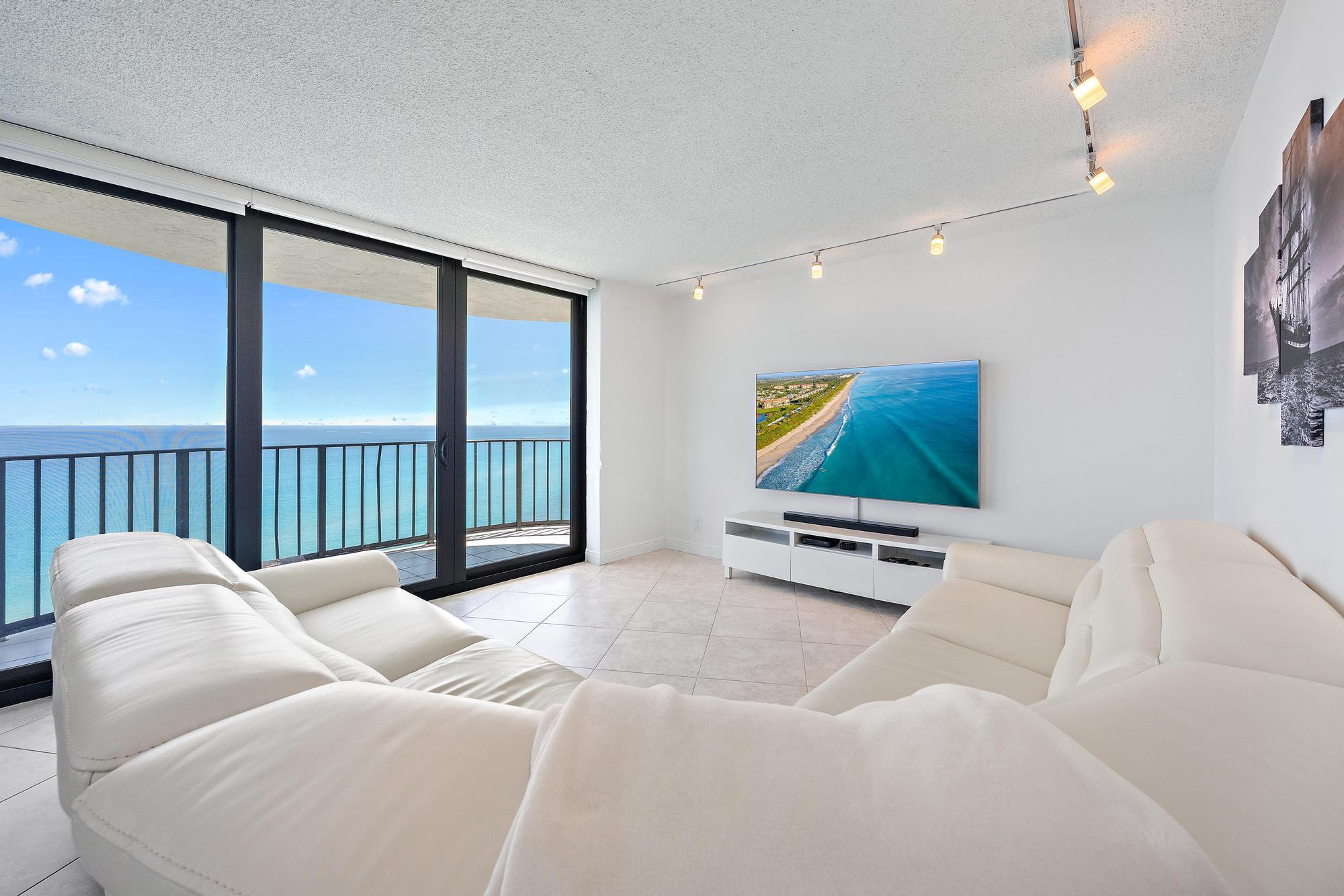 Image 4: Enjoy watching TV and seeing the boats go by from