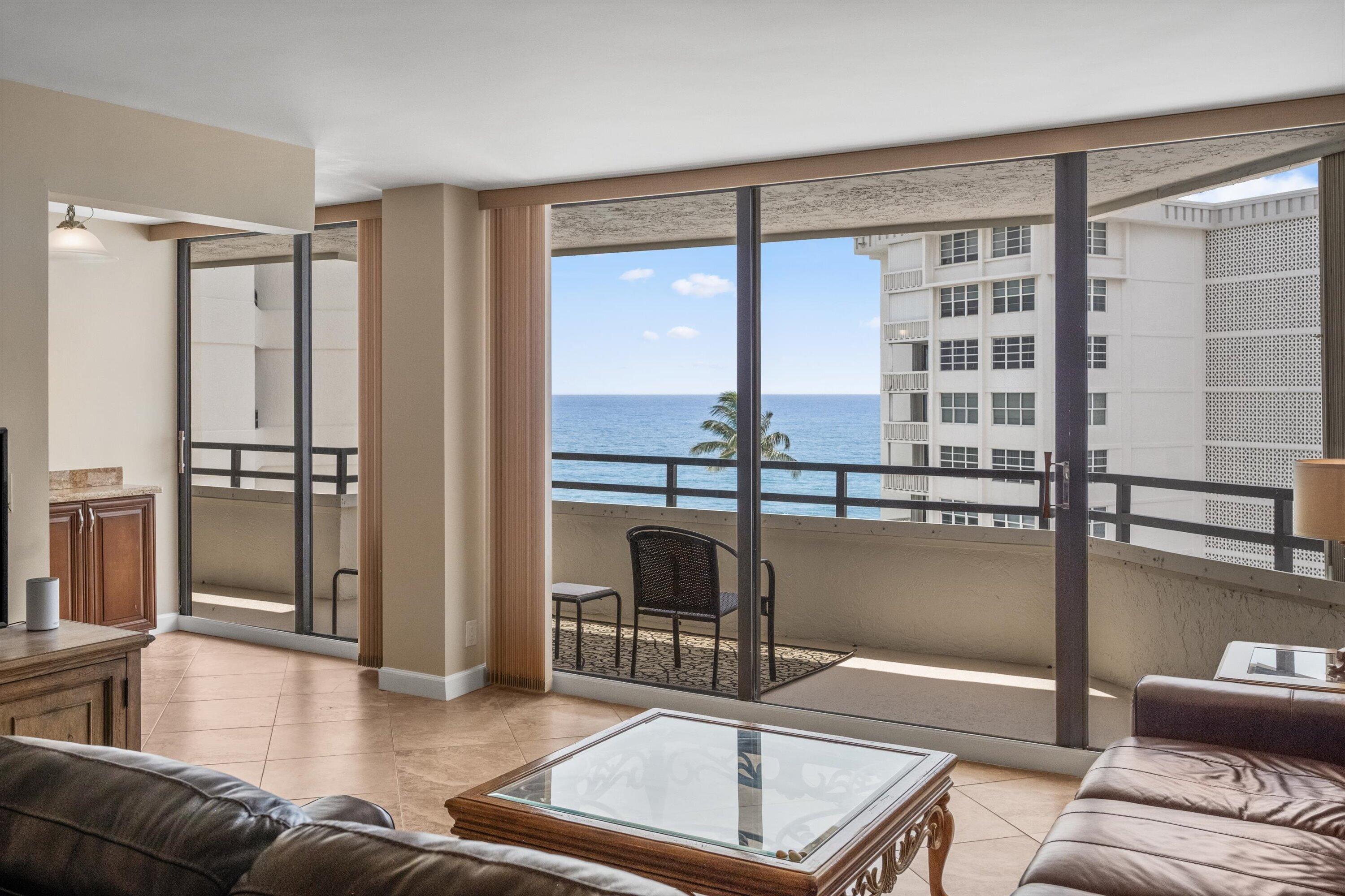 Image 3: Expansive oceanfront living room showcasing floor-
