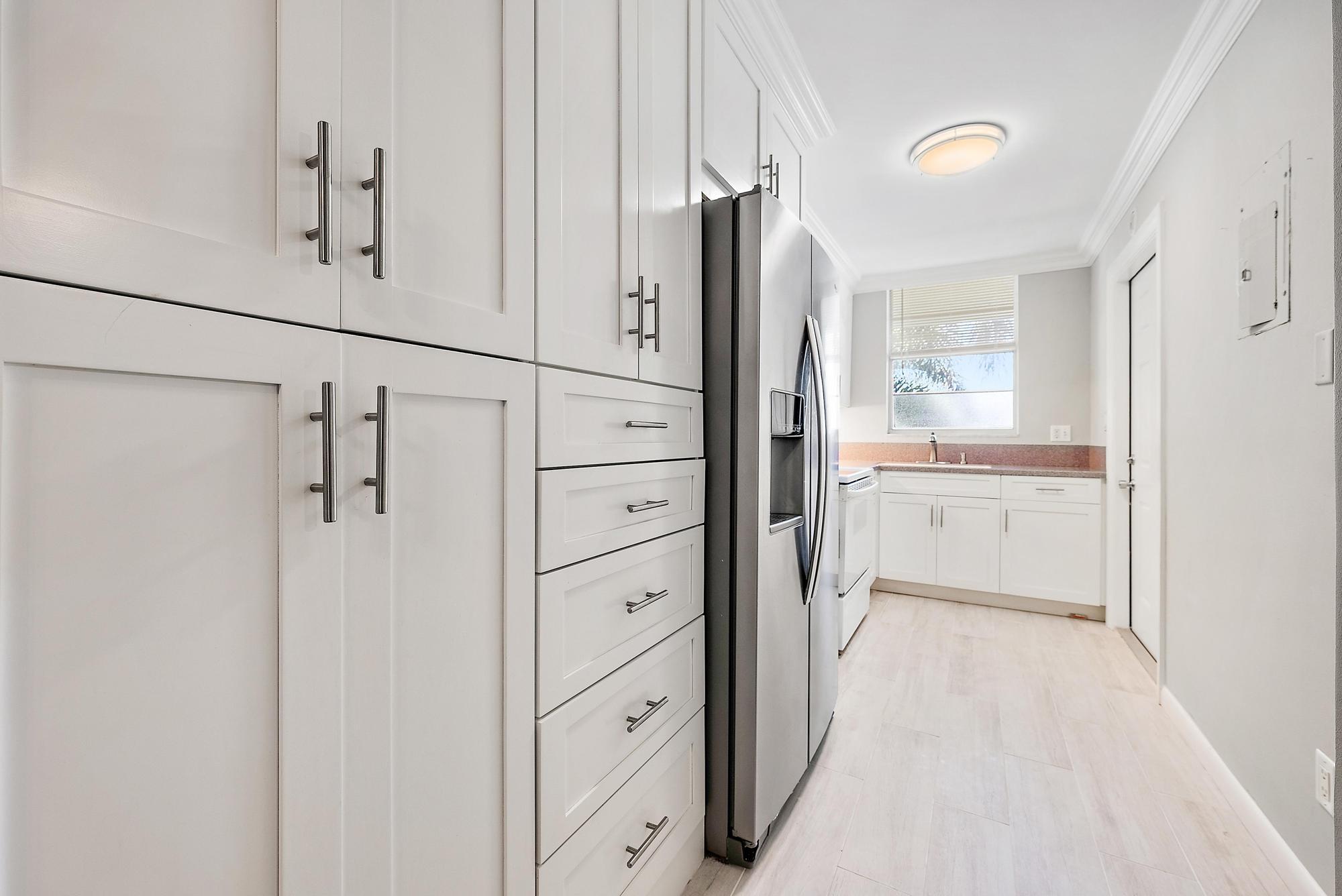 Image 3: Kitchen with lots of storage space.